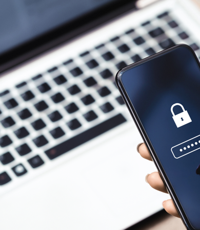 Woman authenticating access to computer with phone